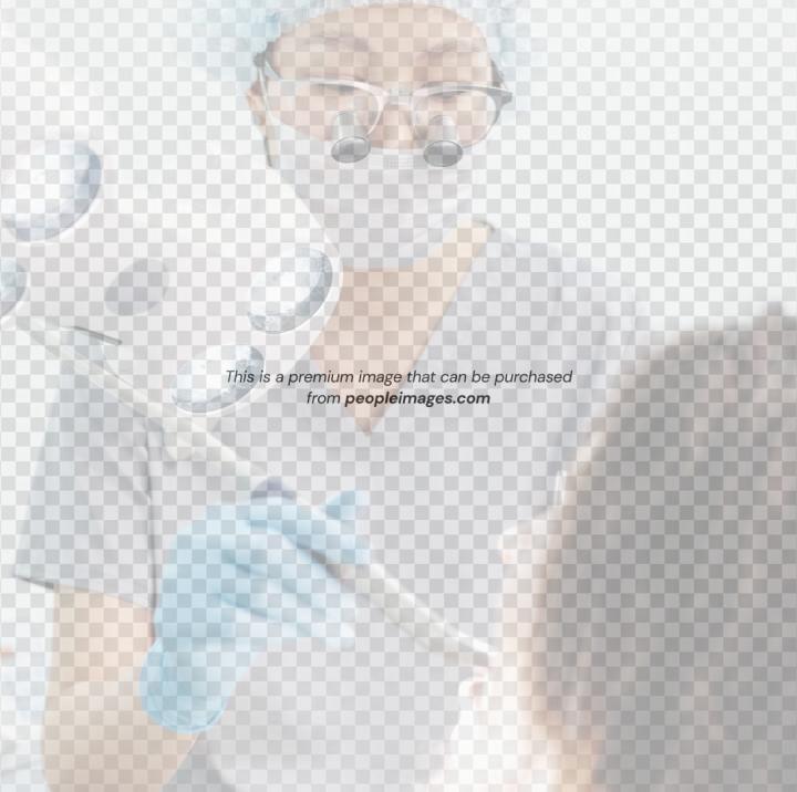 Dentist examining a patient's mouth with dental tools.